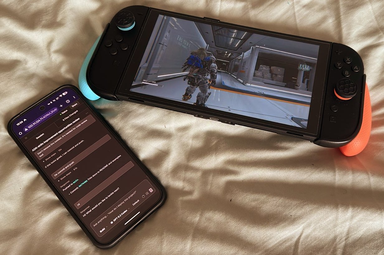 OpenCode on phone beside Nintendo Switch